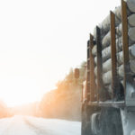 Truck with timber logs on a winter road